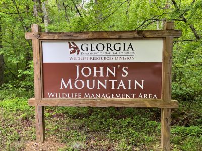 This Thursday we activated Johns Mountain WMA US-3758 from the Overlook site.

Allen KN4FKS set up his end fed half wave sloper antenna under the trees and Dan K2DTS warmed it up first. He made 20 contacts on 20 meters SSB. the band was wonky and contacts were either long or close. He had one in Alabama and one in California. Allen then used the same rig to make 21 contacts on 20 meters SSB with 7 P2P and 3 DX contacts which included a park to park in Bermuda before the rains came.

Danny AG4DW cranked up his rig using a vertical antenna and made 4 SSB contacts, 25 FT8 contacts and 2 FM contacts. With the two FM contacts on the 1.25 m band he accomplished a rather hard to get POTA award. The POTA N1CC award is obtained by making contacts on TEN bands in TEN different parks. He is the first of our crew to get this award, congratulations on all the hard work. John KB4QXI made 20 contacts on 20 meters with 16 P2P contacts and 2 Canadian DX contacts. 

The drive up the gravel road to the overlook is rough as usual but the mountain laurel bushes were in full bloom and made the trip a bit more bearable.

We seem to be in a springtime rain shower loop as every week we seem to be taking down antennas in the rain. Luckily none of the radio equipment has gotten wet. However antennas, coax and throw string need to be dried before the next activation. Hopefully the next activation will be a dry one. 

Again, congrats to Danny on the award. 
