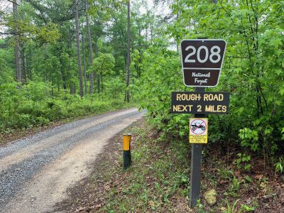 This Thursday we activated Johns Mountain WMA US-3758 from the Overlook site.

Allen KN4FKS set up his end fed half wave sloper antenna under the trees and Dan K2DTS warmed it up first. He made 20 contacts on 20 meters SSB. the band was wonky and contacts were either long or close. He had one in Alabama and one in California. Allen then used the same rig to make 21 contacts on 20 meters SSB with 7 P2P and 3 DX contacts which included a park to park in Bermuda before the rains came.

Danny AG4DW cranked up his rig using a vertical antenna and made 4 SSB contacts, 25 FT8 contacts and 2 FM contacts. With the two FM contacts on the 1.25 m band he accomplished a rather hard to get POTA award. The POTA N1CC award is obtained by making contacts on TEN bands in TEN different parks. He is the first of our crew to get this award, congratulations on all the hard work. John KB4QXI made 20 contacts on 20 meters with 16 P2P contacts and 2 Canadian DX contacts. 

The drive up the gravel road to the overlook is rough as usual but the mountain laurel bushes were in full bloom and made the trip a bit more bearable.

We seem to be in a springtime rain shower loop as every week we seem to be taking down antennas in the rain. Luckily none of the radio equipment has gotten wet. However antennas, coax and throw string need to be dried before the next activation. Hopefully the next activation will be a dry one. 

Again, congrats to Danny on the award. 

