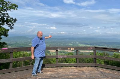 This Thursday we activated Johns Mountain WMA US-3758 from the Overlook site.

Allen KN4FKS set up his end fed half wave sloper antenna under the trees and Dan K2DTS warmed it up first. He made 20 contacts on 20 meters SSB. the band was wonky and contacts were either long or close. He had one in Alabama and one in California. Allen then used the same rig to make 21 contacts on 20 meters SSB with 7 P2P and 3 DX contacts which included a park to park in Bermuda before the rains came.

Danny AG4DW cranked up his rig using a vertical antenna and made 4 SSB contacts, 25 FT8 contacts and 2 FM contacts. With the two FM contacts on the 1.25 m band he accomplished a rather hard to get POTA award. The POTA N1CC award is obtained by making contacts on TEN bands in TEN different parks. He is the first of our crew to get this award, congratulations on all the hard work. John KB4QXI made 20 contacts on 20 meters with 16 P2P contacts and 2 Canadian DX contacts. 

The drive up the gravel road to the overlook is rough as usual but the mountain laurel bushes were in full bloom and made the trip a bit more bearable.

We seem to be in a springtime rain shower loop as every week we seem to be taking down antennas in the rain. Luckily none of the radio equipment has gotten wet. However antennas, coax and throw string need to be dried before the next activation. Hopefully the next activation will be a dry one. 

Again, congrats to Danny on the award. 
