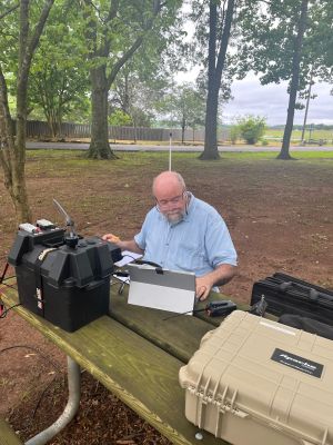 On Tuesday May 27 Danny AG4DW and Allen KN4FKS headed towards Cartersville to activate three parks they had never activated before. A day moving from multiple parks is called a "Rove".

The plan was to start at Etowah Indian Mounds State Historic Site US-3715. After an early drive they arrived at the park at 10 am and set up two stations. Allen set up his end fed sloper wire and made 20 contacts on 20 meters. 6 were Park to Park contacts. Danny had started on 40 meters and it was not producing contacts. He made a few FT8 Contacts then moved to 20 meters when Allen was clear. He had 14 contacts with 9 SSB and 5 FT8 contacts.  It was a new experience to set up, make a few contacts then take everything down and prepare to move to the next park. It just didn't feel right. But that was the plan. 

Next was Allatoona Pass Battlefield State Historic Site US-7471. This Civil War site is a very small site with a small parking lot next to a busy road, and very noisy powerlines. We set Danny's vertical up on top of the adjacent berm with Lake Allatoona on the other side. Using Danny's rig we worked through the noise, shared the radio and Allen made 17 contacts, with 7 P2P contacts on 20 meters. Danny made 14 contacts on SSB. Handing the microphone back and forth saying 'standby for a second operator' was another new experience and again it just didn't feel right. But it worked and we both got an activation. At this site we had a lot of interaction with people walking by. We would take a moment to explain what we were doing "It's not CB" Many had a relative or friend who was into Ham radio. The 'Parks ON The Air' concept was interesting and exciting to all of them. We packed up the gear, then spent a few minutes walking past the monuments and interpretive signage to explore the battlefield site.

Then it was on to Red Top Mountain State Park US-2194. We used the large empty parking lot at group shelter 2 as our base. After a quick lunch we used Danny's radio and Allen's end fed wire antenna. to set up on 20 meters. Again sharing the radio Allen made 12 contacts with 11 P2P. and Danny made a quick 10 contacts. We could hear the static crashes on the radio and the sky was getting darker. A few drops fell so Danny deployed his "sun shade' umbrella to cover the tail gate where we had the rig set up. About the time we both had the 10 contacts required for a successful activation the rain was beginning to fall. As we quickly began to take everything down it began to rain harder, About the time we jumped in the truck it began to pour.

The drive up the interstate from Cartersville to Resaca was exciting to say the least. The rain was hard and at one place the fast lane was not draining and had about a foot of standing water. This was causing cars to spin out into the median, bang into each other and drown out their engines Several state troopers were on the shoulder working fender benders. Somehow Danny was able to safely get us through the mayhem and on up the road. 

It was a fun day, very different and challenging at times. We each added three new parks to our list of sites we have activated. Maybe one day we'll both qualify for some obscure POTA certificate :-)

