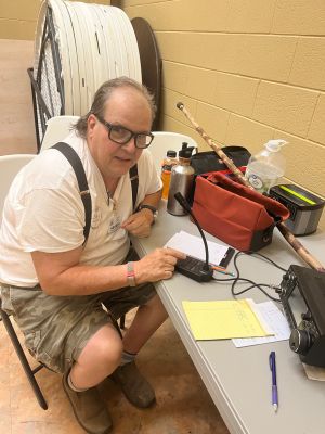 In case you have been under a rock for some time this weekend was the ARRL Field Day event. Several of us with the TSARC set up at the Cedar Grove Community Center in SW Walker County. The community center is a great location for field day with one exception. It has air conditioning a big plus, a full kitchen, lots of space to set up, a basket ball court sized big central room And did I mention air conditioning!. The one problem with the location in the valley is that it is surrounded on three sides by nearby Lookout mountain and Pigeon Mountain. So getting a signal out of this hole is difficult but doable.

We got off and running Saturday afternoon and as usual a big thunderstorm rolled in over the mountain. Quickly we disconnected antennas and watched the rain blow sideways first one direction then the other. Ed KM6UTC has his vertical antenna support tripod blow down but luckily it was not damaged. Then late Sunday  morning here came another big storm so we called it quits and hurriedly got all the antennas down and everything packed away just before the storm hit once more. The timing was excellent as we had just run out of cookies to munch on. A crisis was at hand. 

Field day is POTA done large and all of us have gotten lots of practice operating portable. But field day is not POTA as there were no peanut butter and jelly sandwiches. 

