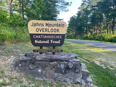 We activated Johns Mountain WMA US-3758 on Wednesday July 9 2025 from the overlook site. It was hot but there was as usual a breeze to make it barrable.

Allen KN4FKS set his usual end fed wire antenna and worked 40 meters SSB. He had 77 contacts with 6 park to park contacts and just 1 Canadian contact. John KB4QXI had 59 contacts with 18 P2P's on 20 meters SSB using his rooftop ham stick. Danny AG4DW set his 'POTA Performer' vertical  and worked 17 meters with 8 SSB contacts and 62 FT8 contacts. He had several DX contacts 1 to Spain, 2 to the Dominican Republic and 4 to Canada. 

The handy thing about operating from the overlook is that you can keep an eye on the developing weather to the west. When we arrived there was not a cloud in the sky. Then a line of small puffy clouds developed over the far ridgeline. Then as the morning moved into afternoon the clouds got bigger and then darker. About 1:30 we noticed a few far off static crashes. My shade moved and I was about to be in full sun. Enough fun, time to pack up and call it a day. We all got packed up and off the mountain then ran into heavy rains on the way home. Excellent timing. Fun day.
