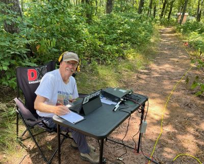 We activated Johns Mountain WMA US-3758 on Wednesday July 9 2025 from the overlook site. It was hot but there was as usual a breeze to make it barrable.

Allen KN4FKS set his usual end fed wire antenna and worked 40 meters SSB. He had 77 contacts with 6 park to park contacts and just 1 Canadian contact. John KB4QXI had 59 contacts with 18 P2P's on 20 meters SSB using his rooftop ham stick. Danny AG4DW set his 'POTA Performer' vertical  and worked 17 meters with 8 SSB contacts and 62 FT8 contacts. He had several DX contacts 1 to Spain, 2 to the Dominican Republic and 4 to Canada. 

The handy thing about operating from the overlook is that you can keep an eye on the developing weather to the west. When we arrived there was not a cloud in the sky. Then a line of small puffy clouds developed over the far ridgeline. Then as the morning moved into afternoon the clouds got bigger and then darker. About 1:30 we noticed a few far off static crashes. My shade moved and I was about to be in full sun. Enough fun, time to pack up and call it a day. We all got packed up and off the mountain then ran into heavy rains on the way home. Excellent timing. Fun day.
