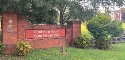 On Thursday Aug. 21, 2025 we activated the Vann House State Historical Site US-7457 This small park is only open on Thursdays, Fridays and Saturdays so it doesn't see a lot of activations. There are lots of picnic tables and a wonderful shade tree to make it a pleasant site even on a hot day. The park manager lady is also a Ham so the staff is definitely POTA friendly. The adjacent museum and visitor center is worth a visit and the actual Vann house is amazing. Our native Americans did not live in Tepees. 

Allen KN4FKS and Danny AG4DW shared a radio set up. They used the end fed wire and the ever trusty Icom 706 MKIIG. Allen made 37 contacts with 5 park to parks on 40 meters SSB. Danny made 22 contacts with 4 P2P also on 40 meters. It was tough work as we had a local QRM source giving us a 5-8 noise level on 40 meters and even 5-6 across all the bands. Don't know what it was but it made getting contacts a challenge. They could hear us but we couldn't hear them.

Dan K2DTS set up his trusty 17 ft. vertical on his car hood. He made 32 contacts on 20 and 17 meters on FT8 and had DX contacts in France, Slovakia, Belize, Guatemala, Czech Republic, Finland, and 2 in Germany. Dave KQ4GLQ set up his vertical and ran his ICOM 705 in a way cool go box set up. He made 61 contacts on FT8. I wore my special T shirt just for him. (see attached photos) 

Earlier in the week John KB4QXI activated Berry College WMA 3734 on Wednesday and Danny AG4DW went to Estelle on Pigeon Mountain also on Wednesday. to edge closer to getting his KILO award for Pigeon. Dave KQ4GLQ and Tony WA4TW joined him there.   
