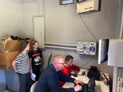 (New information underlined)
Monday Claimed Score: 7,384 pts
Tuesday Claimed Score: 63,308
Wednesday Claimed Score: 123,522
Current Claimed Score: 192,192

Monday Total Contacts: 104
Tuesday Total Contacts: 323
Wednesday Total Contacts: 519
Current Total Contacts: 704

Monday Total Time on-air: 2 hrs, 8 min
Tuesday Total Time on-air: 7hrs, 36 min
Wednesday Total Time on-air: 12hrs, 58 min
Current Total Time on-air: 18hrs, 22 min

States / Canadian Provinces Contacted: (Mon: 32 / Tues: 40 / Wed: 44 / Thursday: 46)
(Long story short: we need Alaska, Hawaii, Nevada, and South Dakota to have a 50-state sweep for this week)
Alabama, Arkansas, Arizona, California, Colorado, Connecticut, Delaware, Florida, Georgia, Idaho, Illinois, Indiana, Iowa, Kansas, Kentucky, Louisiana, Maine, Maryland, Massachusetts, Michigan, Minnesota, Mississippi, Missouri, Montana, Nebraska, New Hampshire, New Jersey, New Mexico, New York, North Carolina, North Dakota, Ohio, Oklahoma, Oregon, Pennsylvania, Rhode Island, South Carolina, Tennessee, Texas, Utah, Vermont, Virginia, Washington, West Virginia, Wisconsin, Wyoming

Canadian Provinces: 
Manitoba
Ontario
Nova Scotia
Quebec

Foreign Countries / Territories: British Virgin Islands, Canada (15X), Canary Islands (Off the African Coast) (2x), Denmark, England (2x), France (2x), Germany (3X), Haiti, Italy (2x), Madeira Islands (Off the African Coast), Mexico, Puerto Rico (8X), South Africa, Spain (3X), Sweden, Venezuela

Total tax-free miles travelled to foreign countries and Canadian Territories: 119,037
(Monday: 11,367 / Tuesday 53,355 / Wednesday:86,331)

Schools:(33) including several elementary schools, Ida Brown Jewish Academy in Illinois, Cornell University (NY), Dixie Heights HS (KY), Houston Christian University (TX), Lampassas Middle School (TX), Michigan State University (MI), Rice University (TX), University of Arkansas (AR), University of Michigan (MI), University of Wisconsin (WI), Youngstown State University (OH)

Clubs: (8) including Ham Radio Outlet in Colorado, FBI in Virginia, a club operating out of a middle school in New Jersey, and Disney World's employee ran club station out of Florida. 

Piglet (Young Ham) Contacts:
Addi: 64 (first time ever!!)
Aulbri: 50 (first timer)
Brianna: 11
Emilee: 103 (first-timer)
Griffin: 101
Halen: 22 
Jacob: 96
Leland: 27 (first timer)
Lilian: 74 (first timer)
Nerf (Jakob J): 47
Syrenna: 64 (first time ever!!)

Updates:
188 contacts Thursday
We are 9 contacts from 713, our former school record - Lord willing, our students will set some records today.
We have some absolutely great students at LMS.
Thanks so much to our teachers for their flexibility this week!
We will be back on the air today from 12 pm to 5:00 pm. 
