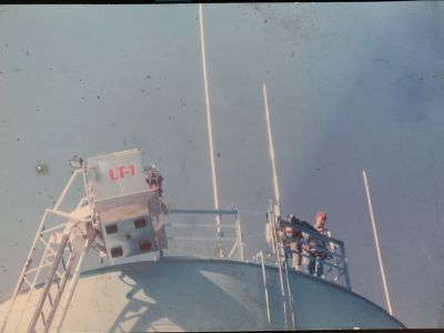 Buddy - KS4QA (now SK), Rick - KI4P and an unidentified person atop the Rossville water tank which was home to the W4GTA 145.350 at the time.  Picture will orientate properly when opened.

