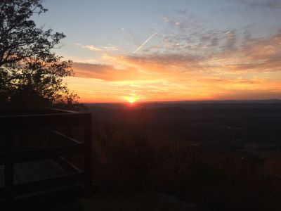 On late Monday afternoon (Oct 23, 2023) we gathered at the Johns Mountain WMA (K-3758) overlook to activate the park, cook a hotdog and watch the sunset. All three objectives were met. We set up three stations and played radio! Danny AG4DW made 43 SSB contacts with 3 P2P, 2 Alaska and one Venezuela mostly on 15 meters. John KB4QXI made 61 contacts with 9 P2P, 5 Canadian contacts plus one North Africa and one Venezuela mostly on 20 meters. Peter KX4BE made 20 contacts on CW with one FM contact for DX he had 2 Japan and one Chile. Allen KN4FKS had 12 contacts with 5 FM contacts on 70 cm. The other 7 were on 40 meters. 

As it got close to sundown at about 7 pm we took a break for supper and to watch the sunset from the overlook. We had hotdogs with the fixins cooked over charcoal, chips, macaroni salad, and smores for desert. There was supposed to be another desert cooked over the fire but someone (Karen KX4KM) forgot the essential ingredient, butter. We were assisted by our mascot dog I4ZZY. 

The sunset was spectacular and the company was the best. Thanks to all the hunters who make our fun possible. 
