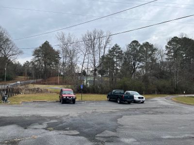 This Thursday Dec 4 2025 we activated Summerville Fish Hatchery US-12771. This site was recently added by the POTA folks and is a difficult one to activate. First the signs are small and faded, two the paved public parking lot is small and there are overhead power lines everywhere. LOOK UP BEFORE YOU SET UP ! There is one small grassy area adjacent to the parking lot. On the good side the hatchery staff is friendly, knows about POTA and welcomes Ham visitors. 

Allen KN4FKS set up a 17 ft vertical in the grassy area and made 63 SSB contacts 5 on 12 meters, 7 on 10 meters, and the rest on 20 meters. He had 13 Park to Park contacts, with DX to Brazil, Spain and the Netherlands. 

Danny AG4DW set up his Pota Performer vertical on the other end of the small grassy spot and made 73 contacts, 37 on SSB and 36 FT8 on 40,20 and 17 meters. He had DX to Canada (2) France (2) and Spain (2). 

John KB4QXI got there late as usual and set up next to the dumpster with his ham stick on top of the car. He had 56 SSB contacts on 20 meters with 15 P2P contacts with three P2P's with Canadian parks. 

Dan K2DTS set up across the parking lot with his 17 ft whip mounted on the car. He had 24 contacts 7 SSB and 17 FT8 on 20, 17, and 15 meters. He had DX to Canada, Italy, Belgium, France, Ecuador, and the Canary Islands. 

Apologies to Danny as I completely forgot to take his photo when I had the camera out even though I had him take my photo. Maybe next time.
